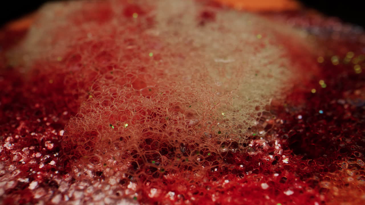 Abstract Macro Photography of Red Bubbles and Glitter