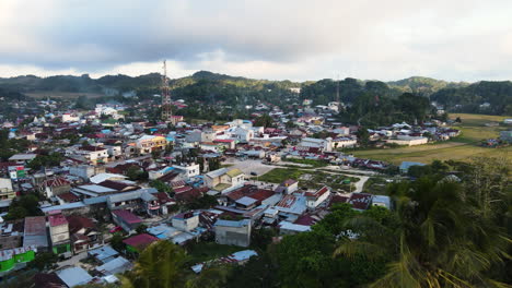 Drone-Fly-Over-Townscape-With-Tropical-Nature-At-Sumba-Island,-Indonesia