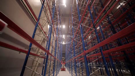 big and modern warehouse under construction, featuring metal shelving and other industrial equipment.