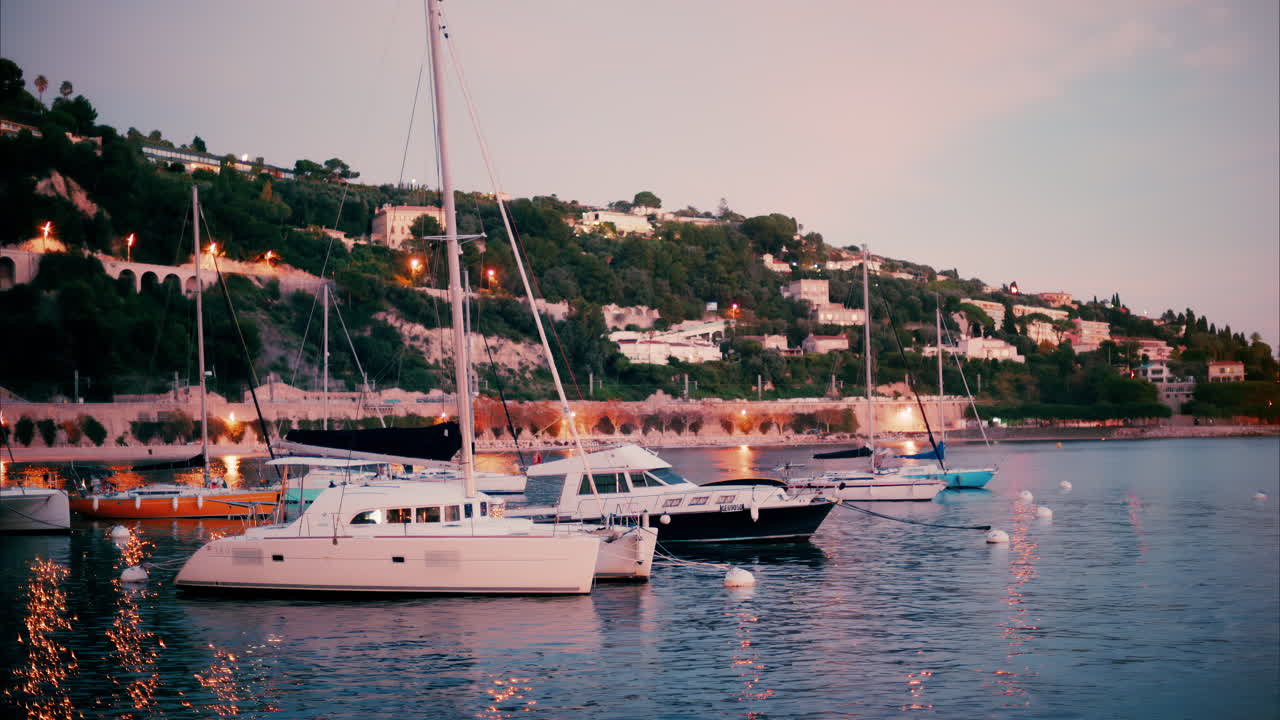 Villefranche Sur Mer, France - December 8, 2024: Boats docked in the Port de Villefranche-sur-Mer in the evening