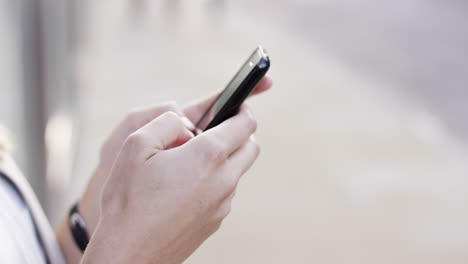 closeup woman hands using touchscreen tablet smartphone device