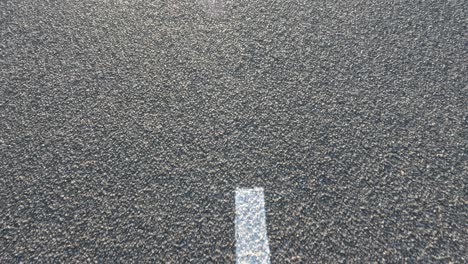 white lines on asphalt road surface