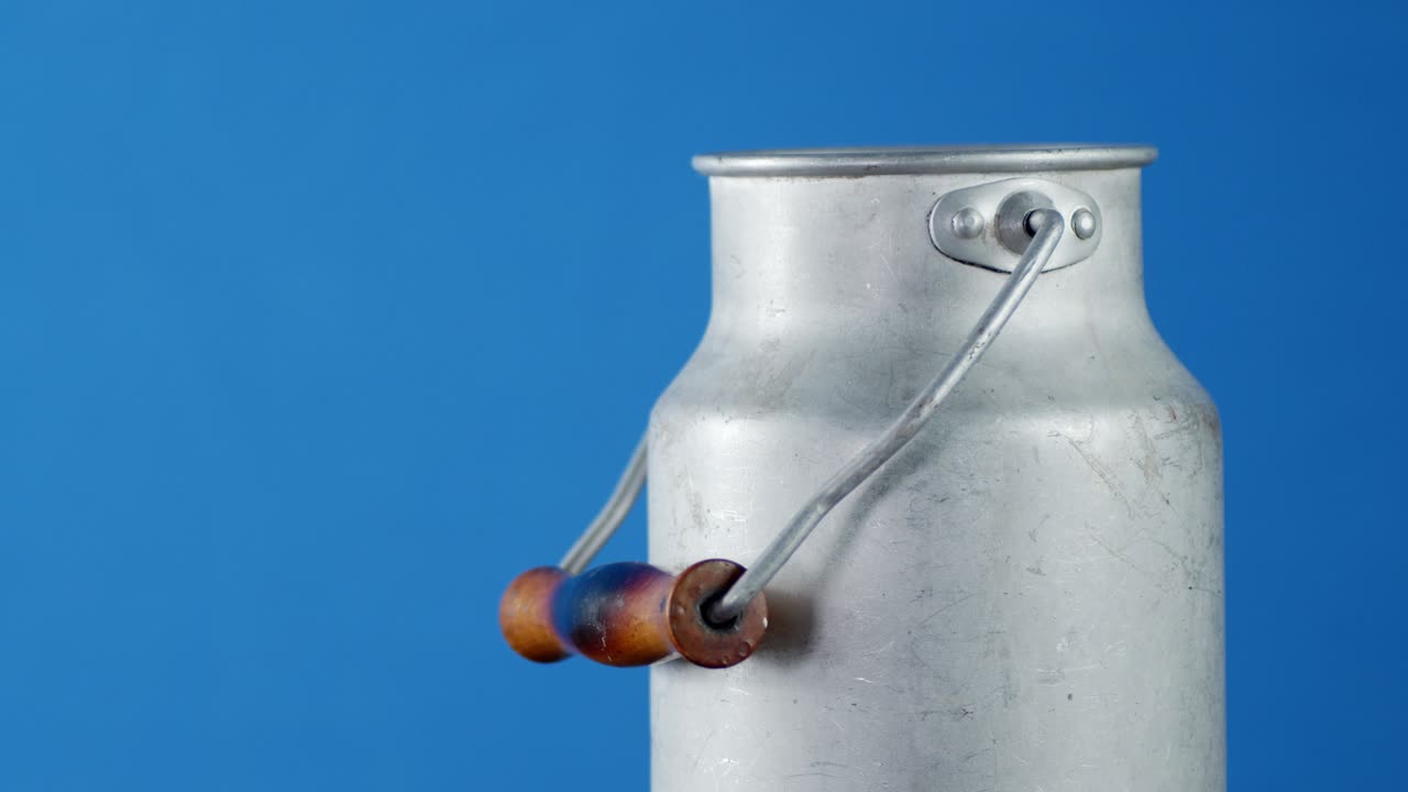 A jug of milk slowly rotates.