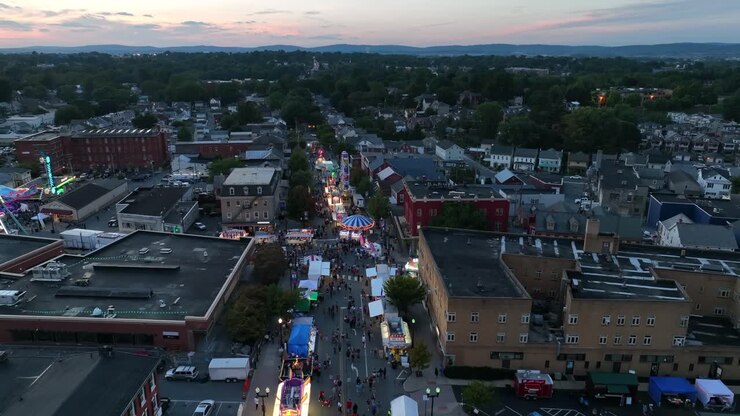 American street carnival at sunset