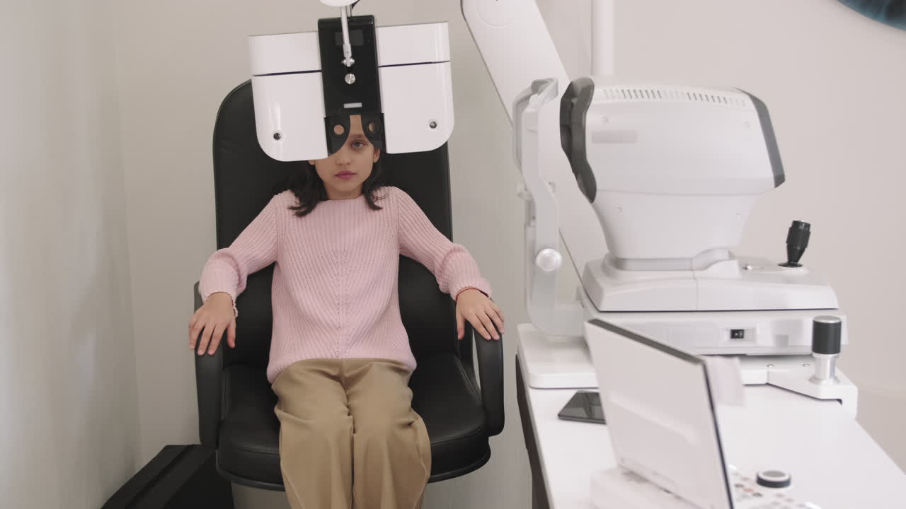 Little Girl Doing Eye Vision Test