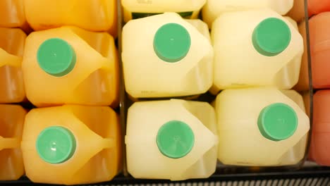 Plastic-bottle-of-orange-juice-in-a-shelf-,