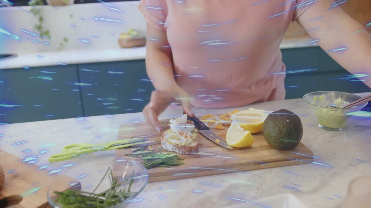 Home cook lifting bowl, sprinkling red spice on egg toast for cooking content, blue streak sweeping