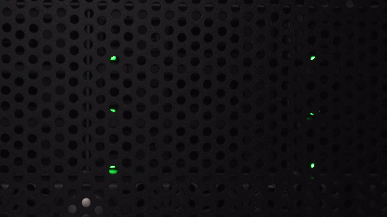 Green Lights Inside A Data Server Cabinet In The Dark Room - Close up