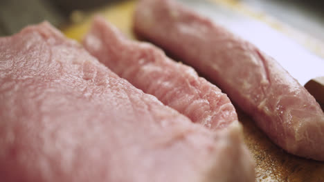 close-up of a tollo fish loin on a wooden board