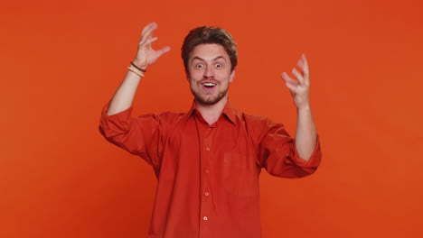 excited amazed caucasian man touching head showing explosion celebrating success good idea answer
