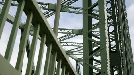 industrial steel bridge looking up at strong girder beam support framework left dolly