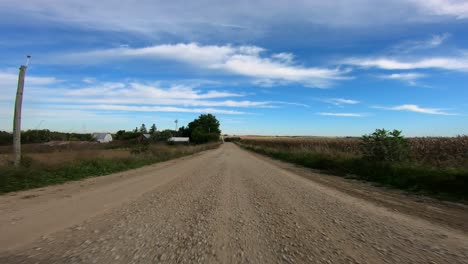 Point-of-view-footage-while-driving-down-a-gravel-road-in-rural-Iowa