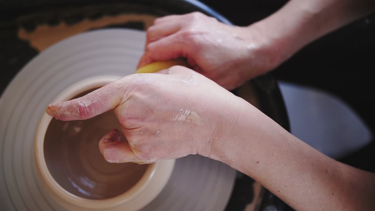 Potter's wheel potter works with his hands