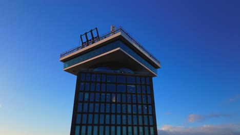 Crane rising A&#039;DAM tower skyscraper downtown Amsterdam tourist attraction