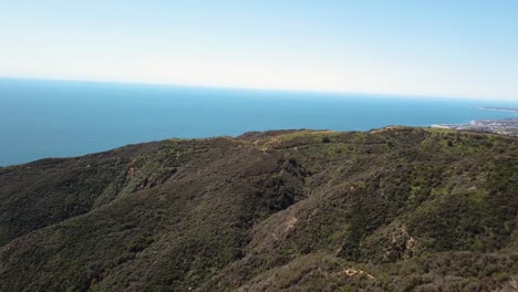 beautiful panning aerial view with drone of malibu and santa monica mountains in los angeles, california on a sunny day
