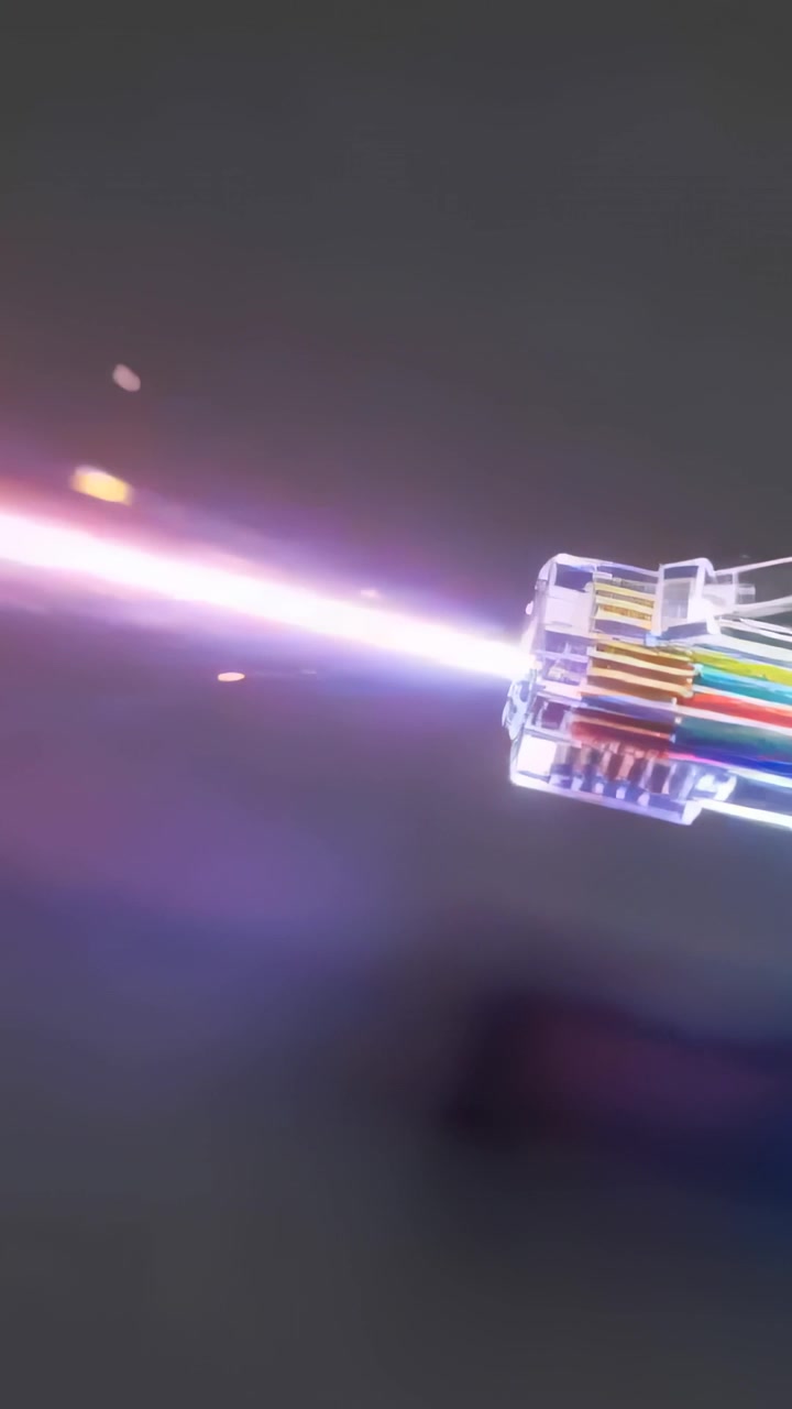 Vertical video: Emitting clear RJ45 with wires sending data beam with sparks on gray, copy space