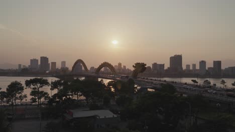 iconic landmark dragon bridge cau rong and city skyline during sunset in danang, vietnam
