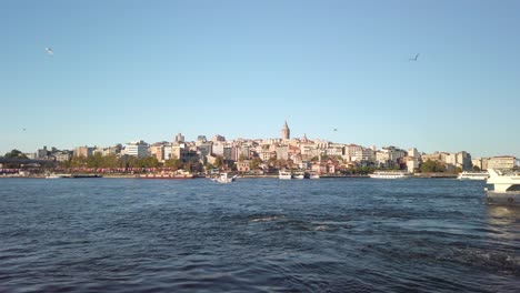 daytime, a view from the eminonu pier in istanbul captures the cityscape of beyoglu