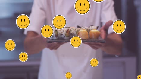 Animation-of-emoji-icons-over-diverse-chef-with-sushi