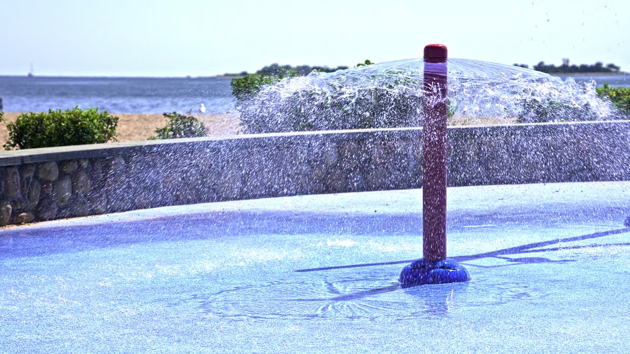 Water sprays up from vibrant structures, creating joyful moments amidst laughter and play