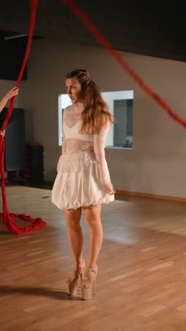 performance with red ribbons and white dresses