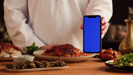 middle eastern cuisine display with smartphone