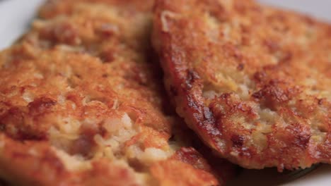 three patties rotating with a plate