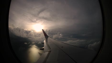 sunset and lovely clouds from the window of the left wing of the airplane brings back travel memories