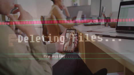 Coworkers using smartphone and laptop in business office, showing glitch processing overlay