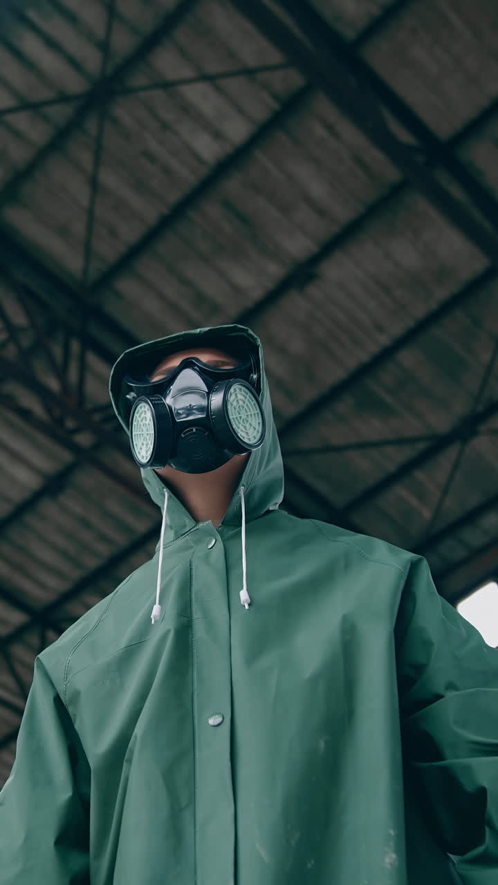 Man in chemical protection. Man in respirator against nuclear background