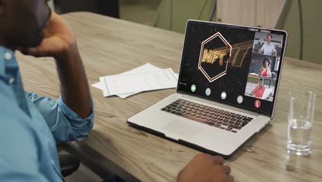 video of african american man having nft video call on laptop with diverse coworkers