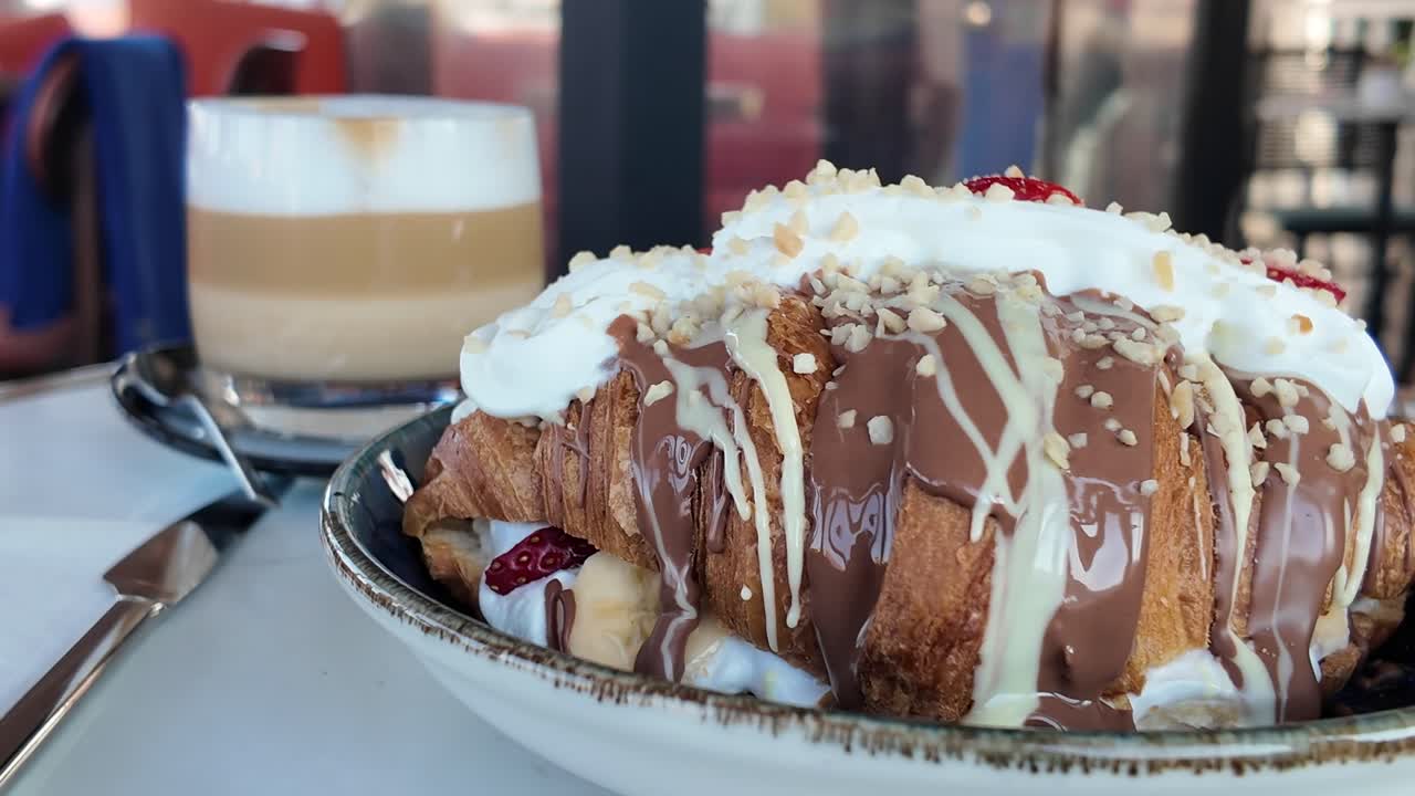 Delicious Chocolate Covered Croissant with Strawberries and Whipped Cream