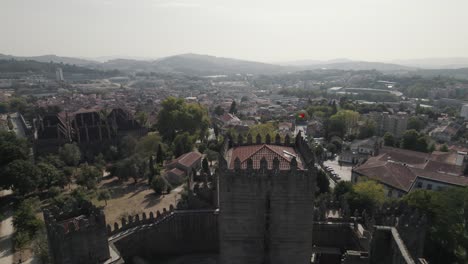 low drone flight over medieval guimaraes castle grounds