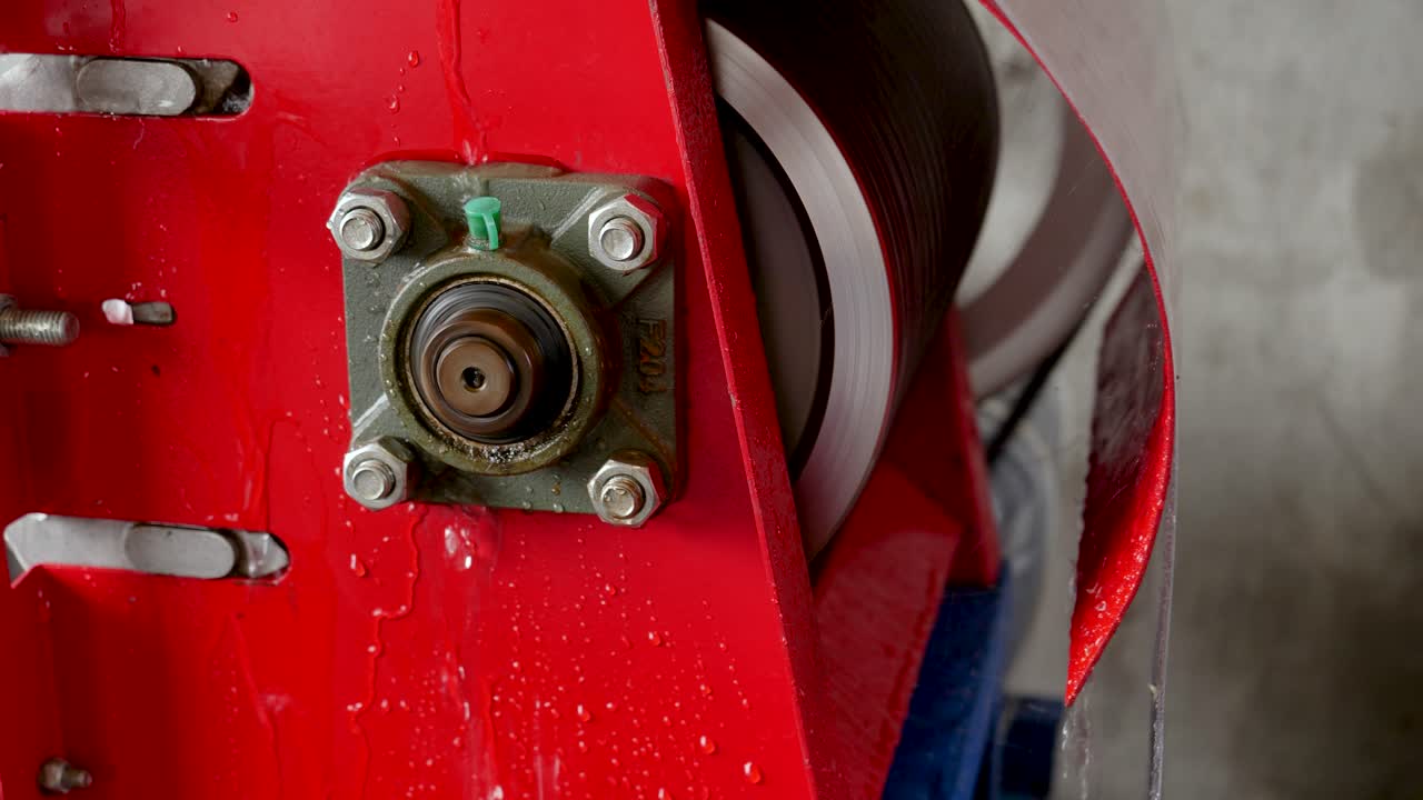 Closeup footage of coffee bean peeling machine working