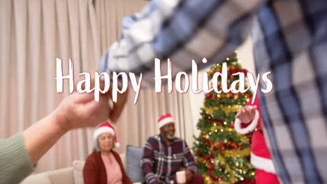 animation of happy holidays text over diverse senior friends dancing at christmas at home