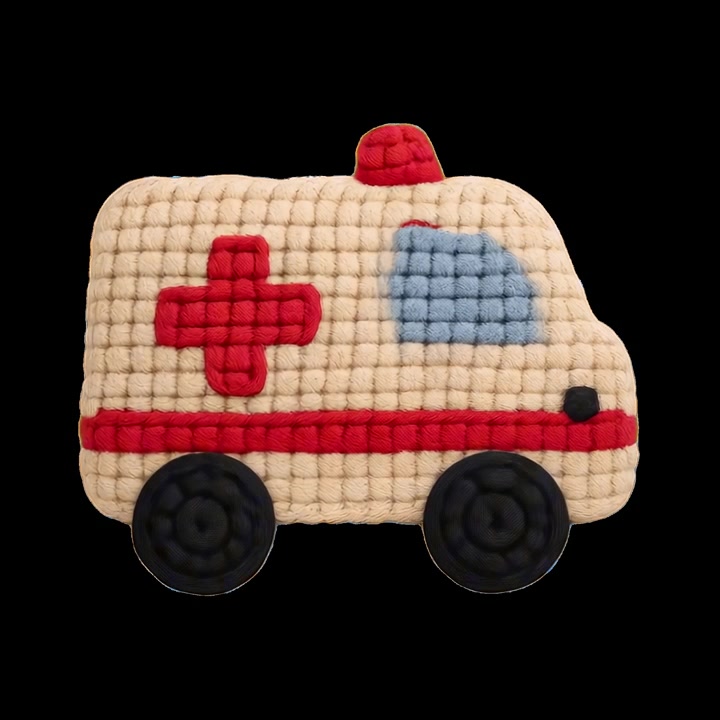 Ambulanza giocattolo lavorata a maglia isolata su sfondo nero