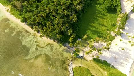 drone panning overhead, moving from the miami beachfront to reveal the surging waves of the mediterranean sea to the coast of itea in greece