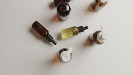 high angle view of glass bottles with copy space on white background