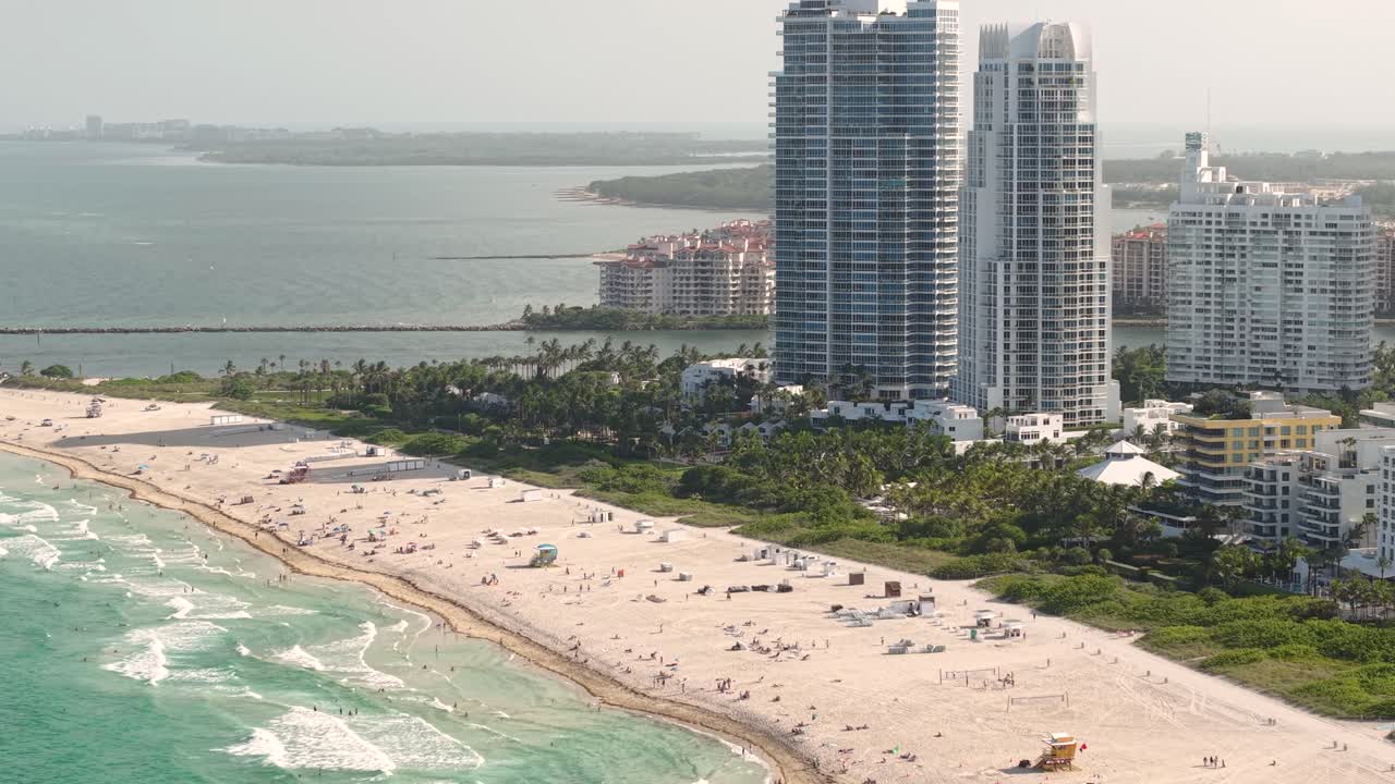 Aerial View of South Beach Miami, Florida USA, People on Sandy Shore, Ocean Waves and Beachfront Condominium Towers