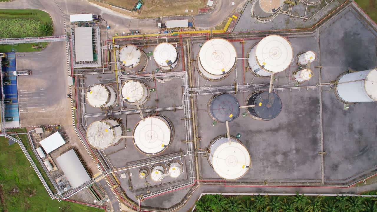 Aerial view white fuel storage tank in oil refinery plant. Top view white Industrial tanks for petrol and oil.High angle view industry business station. Building infrastructure