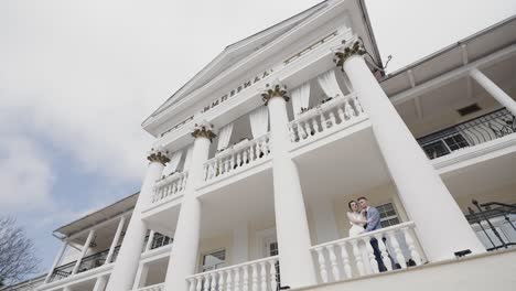 elegant wedding couple at a classic building