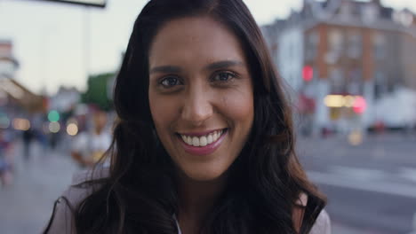smiling portrait of beautiful woman in the city