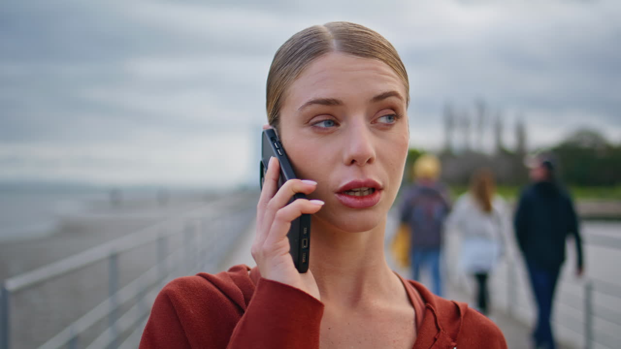 Walking lady talking mobile phone closeup. Relaxed sportswoman have conversation