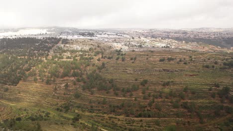 snowy mountainous landscape with city view