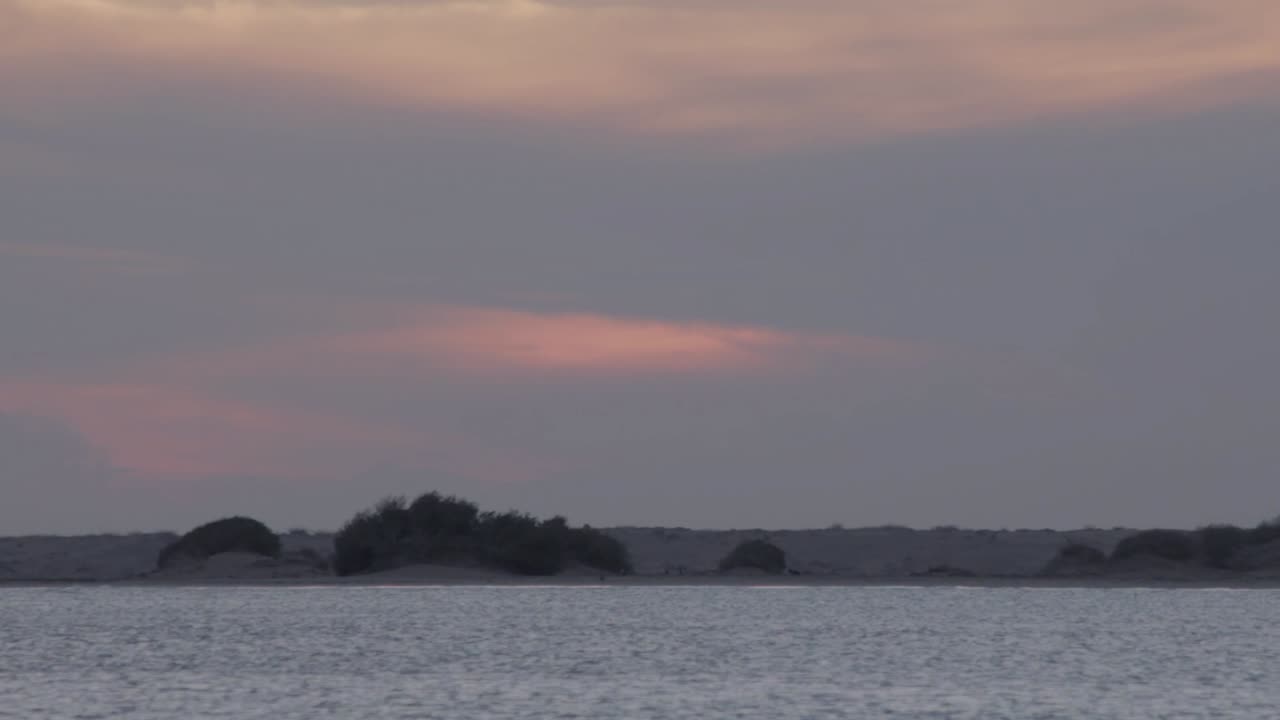 Sand dunes with grass at the Guajira desert in Colombia. National Park La Macuira