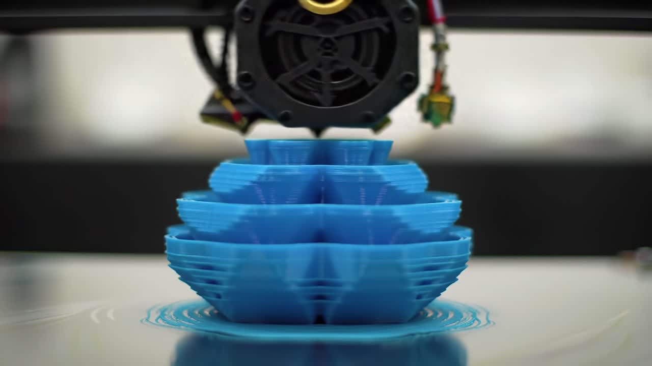 A Close-Up Look at the 3D Printing Process: Creating Intricate Blue Designs Layer by Layer with Precision and Innovation in Modern Fabrication Technology
