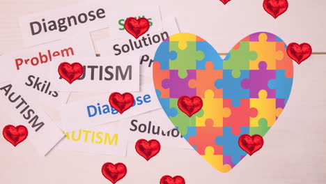 animación de corazones sobre corazones hecha de rompecabezas y textos de autismo