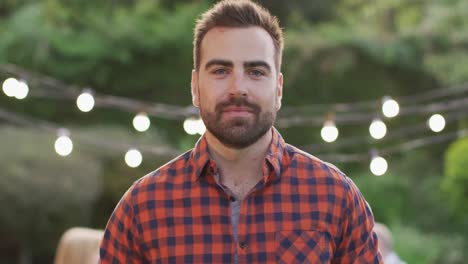 young man smiling outdoors