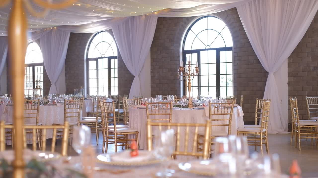 Chairs Around White Tables At An Indoor Wedding Venue - Wide Shot
