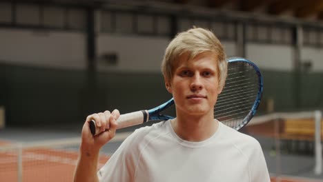 man holding a tennis racket